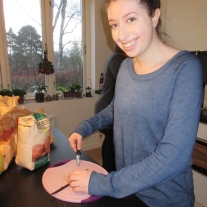 Chloe scraping Vanilla from a Vanilla Bean